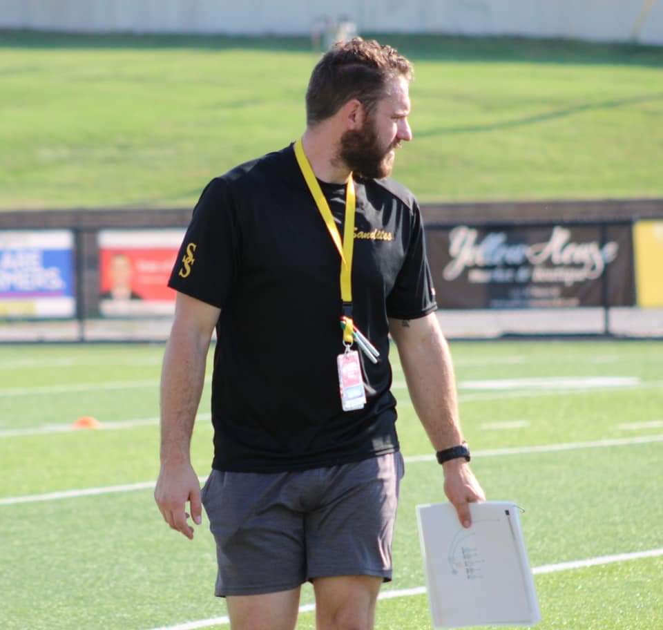 Coach Hopper coaching young athletes